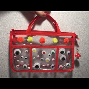 Pompom googly eye baggy purse